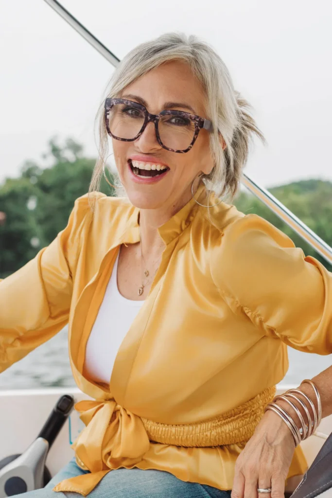 Dr.Julie Lopez at the helm of a boat